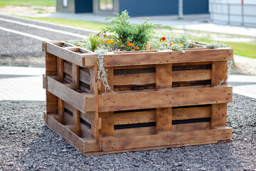 flower beds with flowers made of wooden pallets