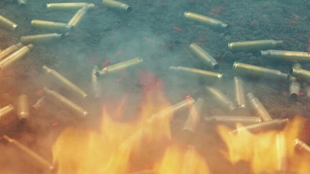 Fire And Smoke On Battlefield With Scattered Bullet Shells