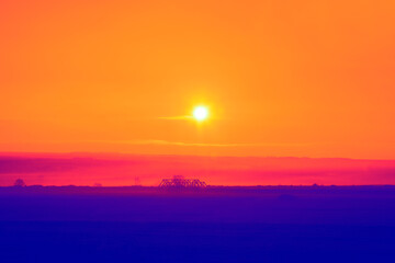 Blue land and orange sky with sunset . Imaginary twilight