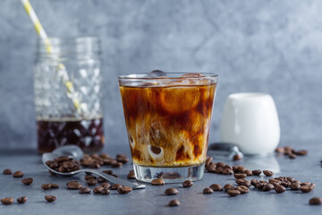 Iced coffee with ice cubes in glass