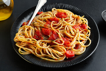 Tomato pasta with cheese on plate