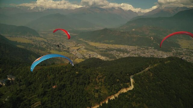 paragliding in the himalayan mountains 