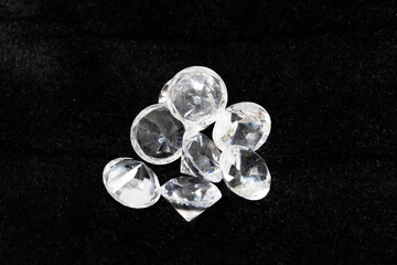 a bunch of glass stones in the form of diamonds on a black background