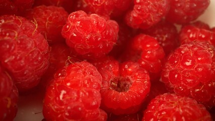 Raspberries in a bowl. Raspberries in plates close-up.