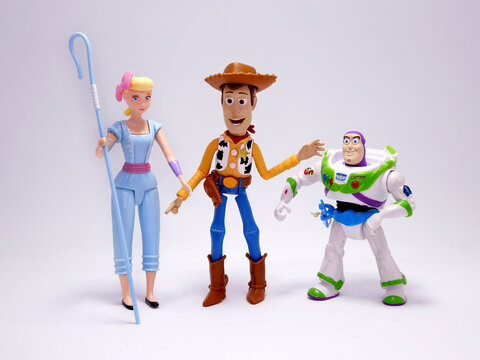 Toy Story movie. Woody, Bo Peep and Buzz Lightyear. Pixar and Disney movie toys. Cowboy, shepherd and astronaut. Porcelain doll of a night lamp. . I will be your faithful friend. Isolated white.