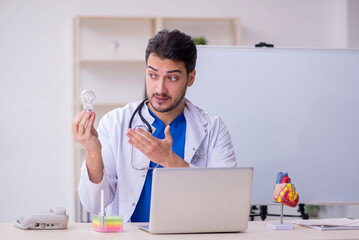 Young male doctor cardiologist in the classroom