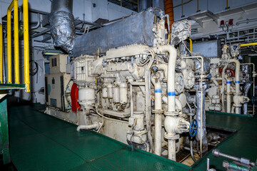 Fototapeta na wymiar Marine engine. Diesel generator. Engine room interior.