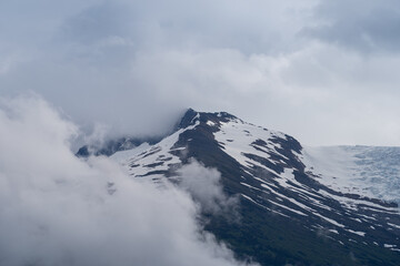 Fototapeta na wymiar Looking up at clouds and glaciers near Sumdum glacier