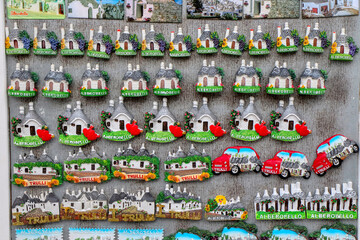 Souvenir shop sells magnets in the old town of the city of Alberobello, Puglia, Italy