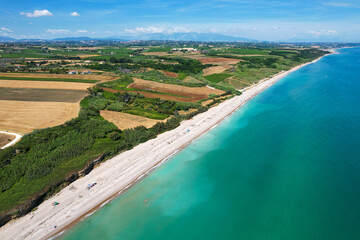 Italian coasts photographed with drone from above. It offers one of the most beautiful stretches of coast in Puglia, Italy with sandy beaches and clifs. Vacation and recreation sites 