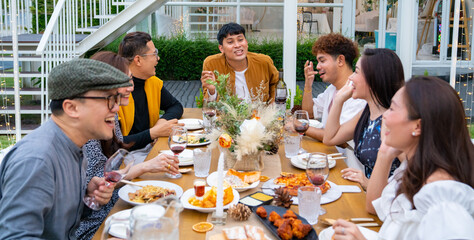 Group of diversity Asian millennial people friends enjoy outdoor garden dinner party eating food...