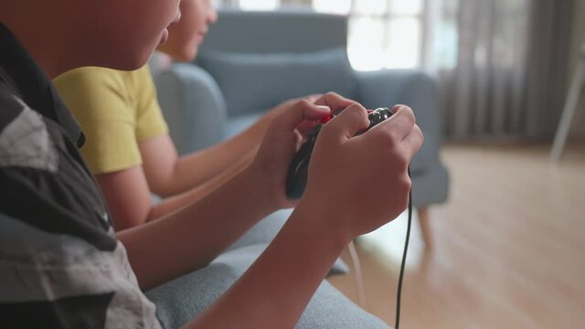 Close Up Children Holding Joystick Game Play Video Game At Home
