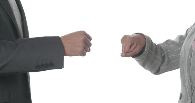 Businesswoman refusing to shake hands with colleague and they bumping fists instead on white background