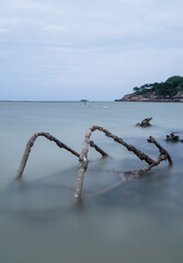 Fototapeta premium Old broken steps in the sea with long exposure and copy space