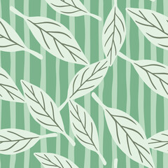 Modern fashion seamless pattern with random leaf silhouettes. Green striped background.