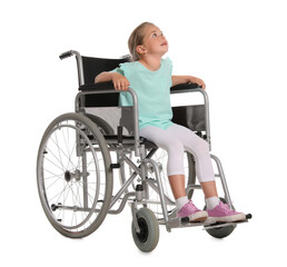 Little girl in wheelchair on white background