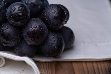 Photo of grapes on a cloth.
A variety called Nagano Purple.