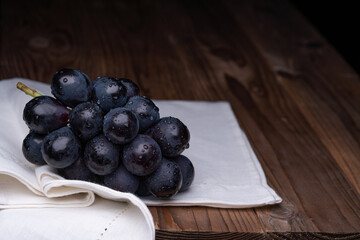 Photo of grapes on a cloth.
A variety called Nagano Purple.