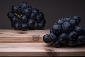 large grapes on a cloth on a black background.
A variety called Nagano Purple