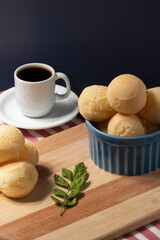 Breakfast with cheese bread and black coffee.
