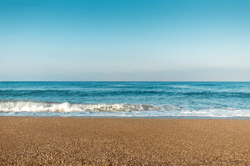 Fototapeta na wymiar Beach, blue sea, waves. Laptop, rest, walking along the beach.