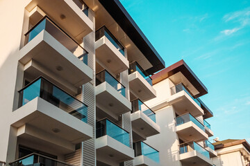 Beautiful view of modern hotels, glass balconies, white facades. Those, path, good hotels.