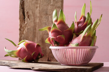 Ripe organic dragon fruit on pink background, tropical fruit mostly in Southeast Asia, refreshing...