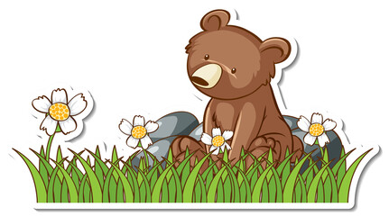 Obraz na płótnie Canvas Grizzly bear sitting in a grass field sticker
