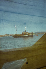 old wooden boat in mirror