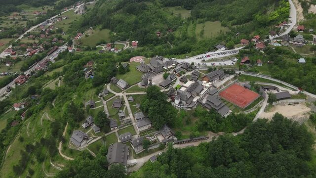 Aerial View of Mokra Gora, Mecavnik Hill and Drvengrad Village, Serbia. Tourist Attraction in Green Serbian Landscape, Drone Shot