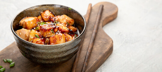 Traditional homemade fried tofu with sesame on light gray background.