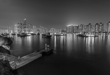 Night scenery of harbor and skyline of Hong Kong city