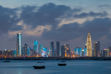 Skyline of Shenzhen city, China at night. Viewed from Hong Kong border Lau Fau Shan