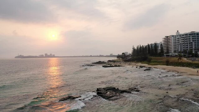 Golden Hour At Mooloolaba Beach With Buildings At The Seashore In QLD, Australia. aerial