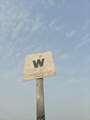 W wooden sign post
