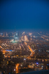 Night Aerial View Of Dubai Cityscape Skyline. Top View Skyline Cityscape City In Night Illuminations. Dubai, United Arab Emirates