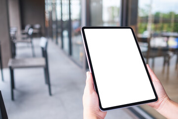 Mockup image of a woman holding digital tablet with blank white desktop screen