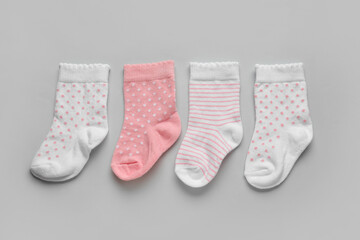Baby socks on light background