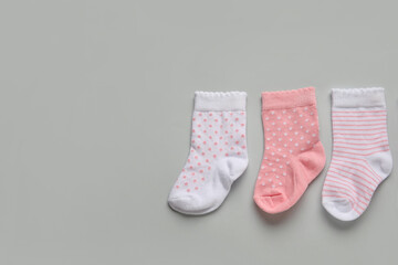 Baby socks on light background