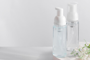Transparent plastic cosmetic foam pump bottle mock-up.