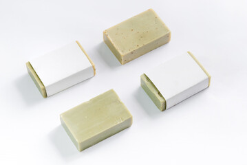 Hand made olive soap bars on white background, top view. Mockup for design