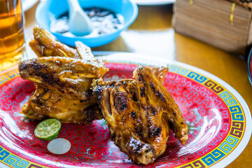 Indonesian Sundanese food grilled chicken of ayam kampung bakar served in restaurant menu 