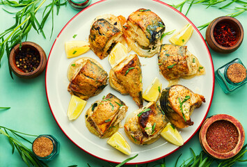 Sliced baked mackerel on an onion pillow