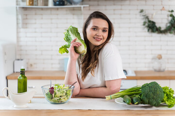 woman preparing a salad in the kitchen