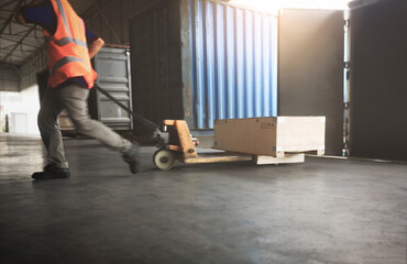 Warehouse Worker Unloading Package Box Out of The Inside Cargo Container. Truck Parked Loading at...