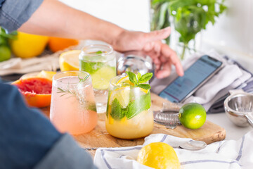 Mixologist making refreshing cocktails with hard seltzer at home