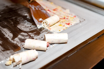 Handmade ice cream rolled into rolls