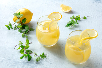 Lemonade. Homemade fresh drink with lemon and mint, with ice. Fresh citrus beverage. Refreshing organic ice tea. Healthy summer detox diet