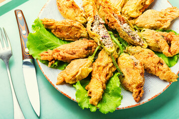 Stuffed fried zucchini flowers.