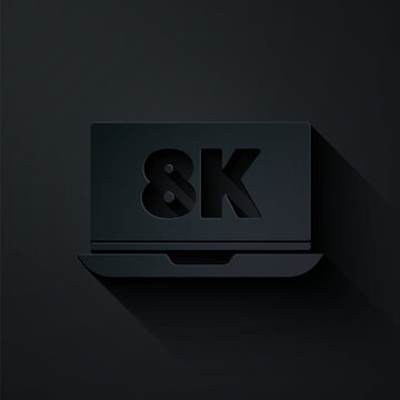 Paper cut Laptop screen with 8k video technology icon isolated on black background. Paper art style. Vector